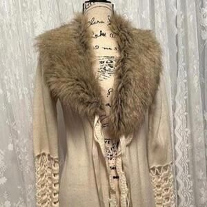 Stay warm and stylish this winter with this faux fur jacket!